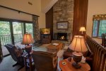 Comfy and cozy living area with stone fireplace